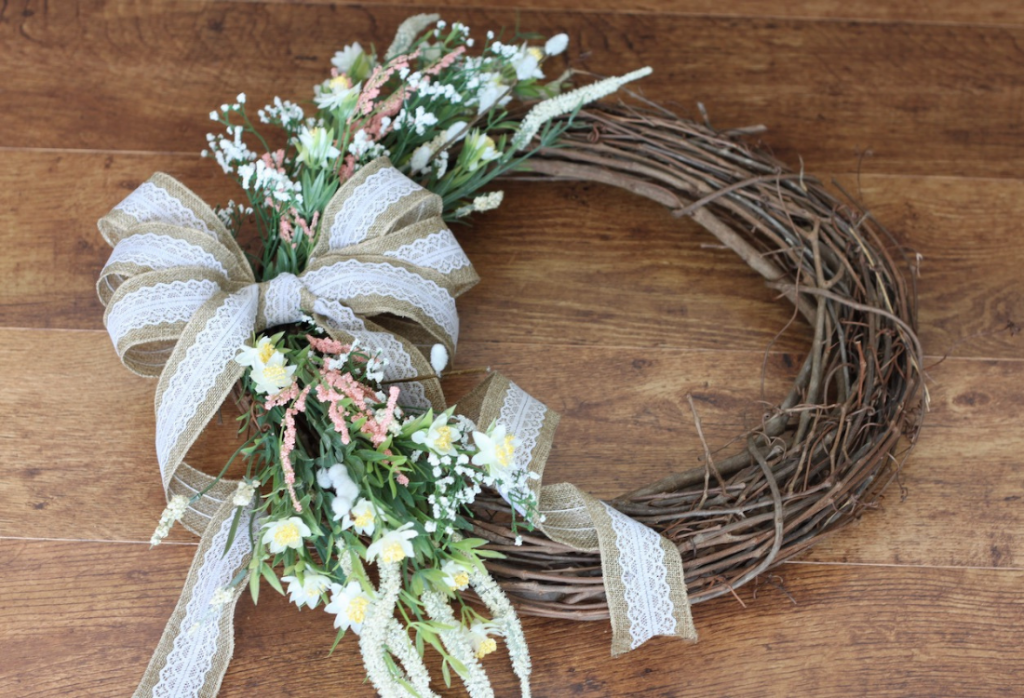 Closeup of spring wreath laying on a wooden background