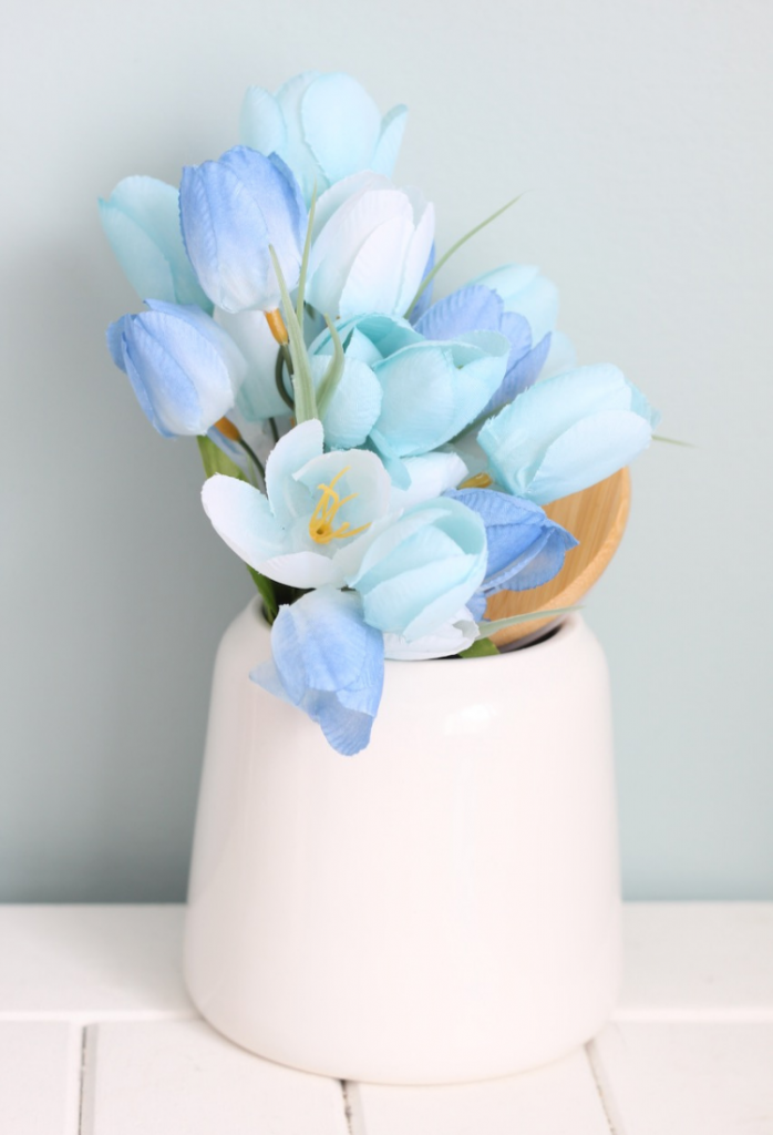 Blue tulips in white crock