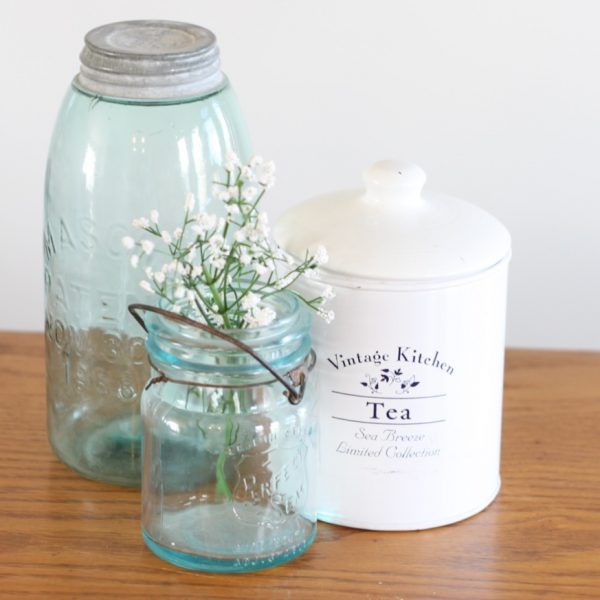 Blue glass jars with white enamel tea tin