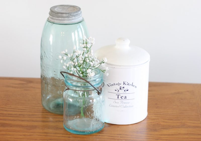 Blue glass jars with white enamel tea tin