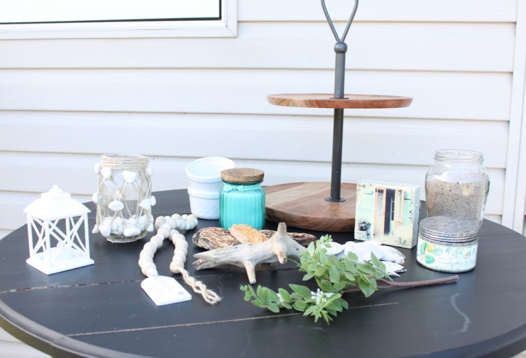 Tiered Tray and Beach Lake Theme Decor on black table