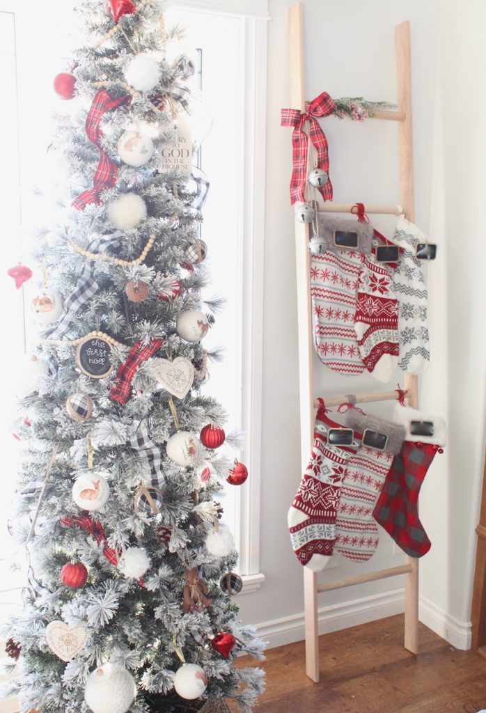 DIY Christmas stocking ladder by Christmas tree-a great no fireplace/mantel option