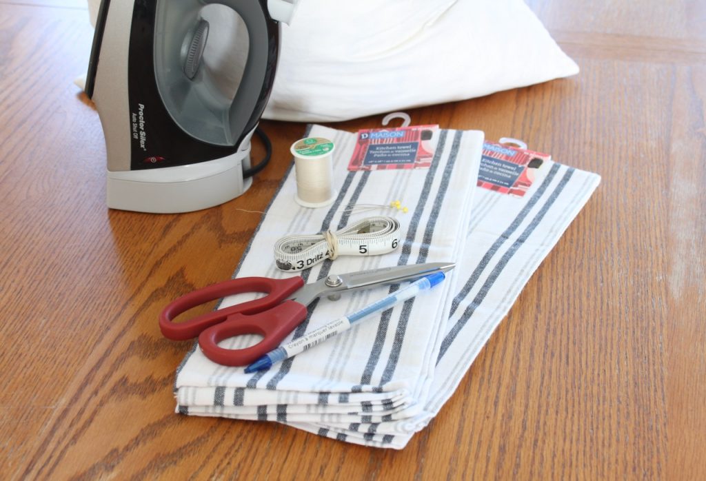 Tea towels, iron, scissors, thread, pins and marker