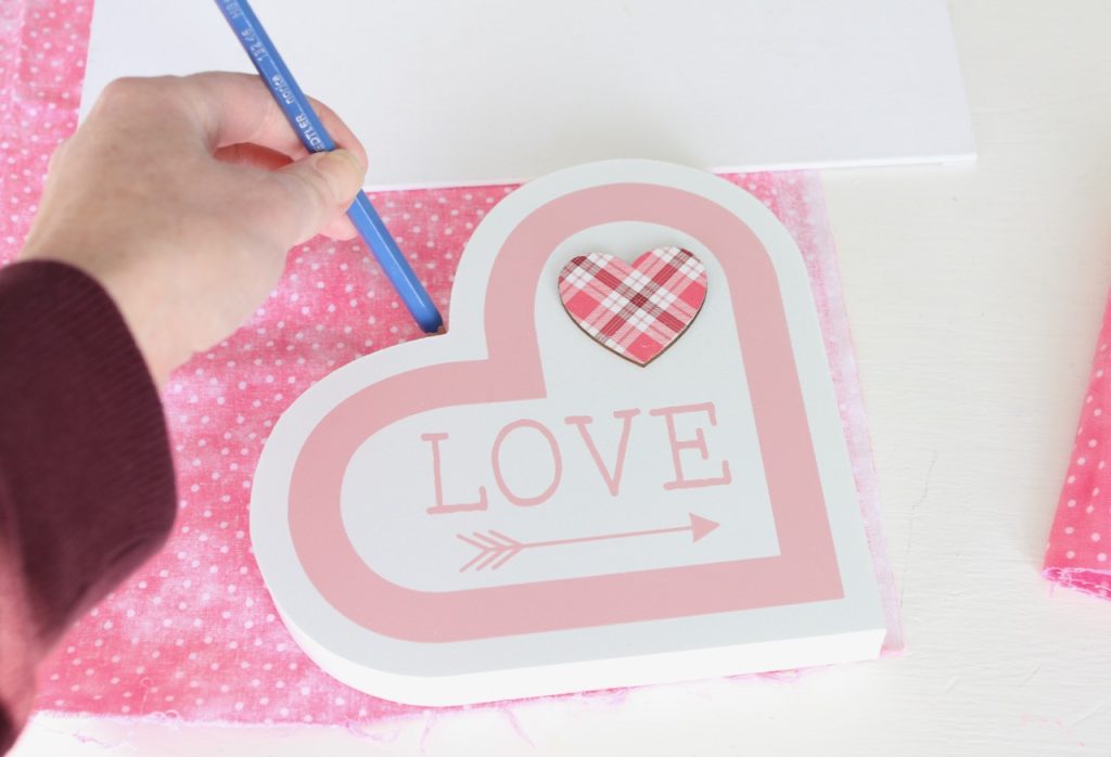 Tracing heart on canvas for art DIY